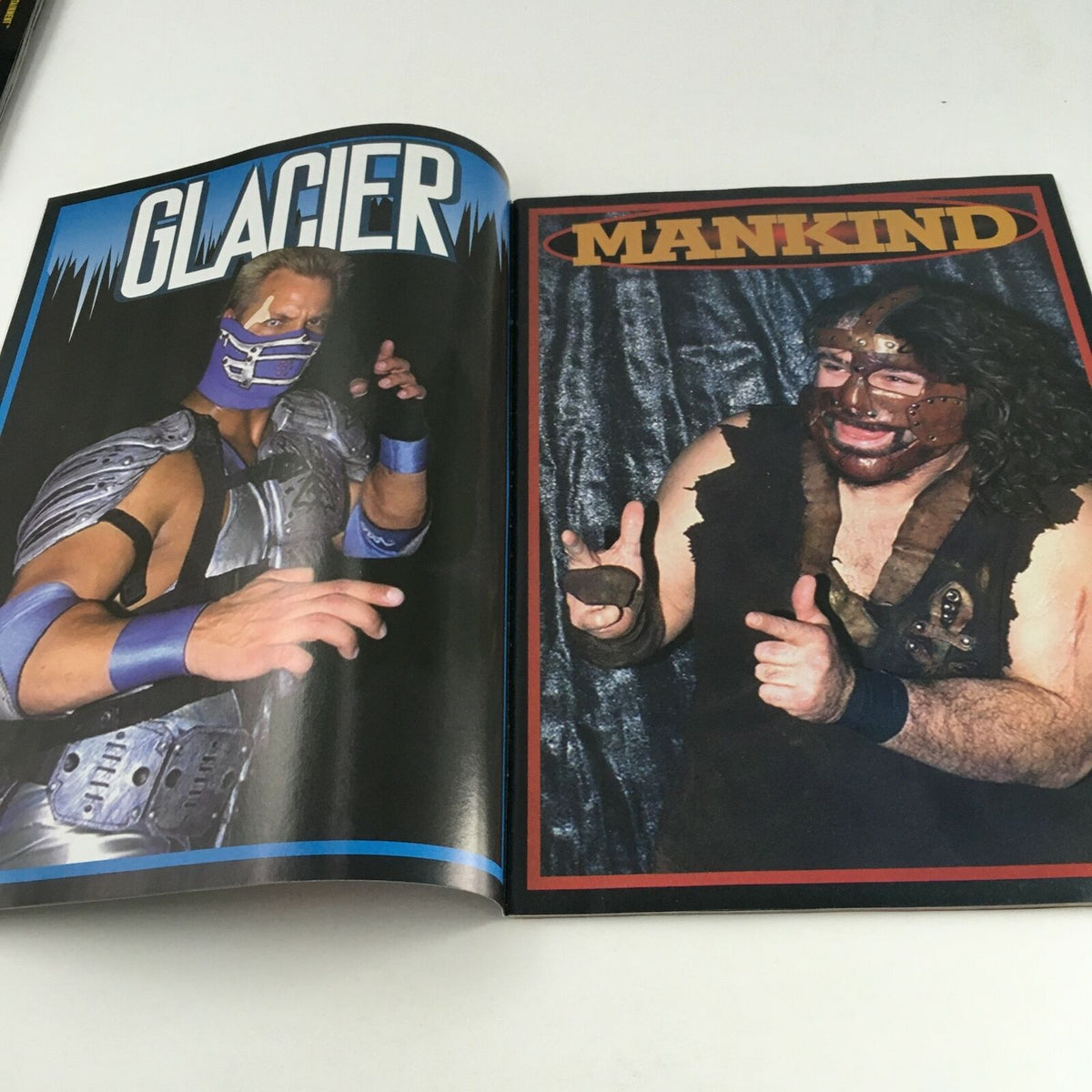 Inside spread of Ringside Wrestling Magazine September 1997, featuring promotional pages for wrestlers Glacier and Mankind. This dual-page layout showcases vibrant graphics and highlights fan-favorite wrestlers from the late 1990s.