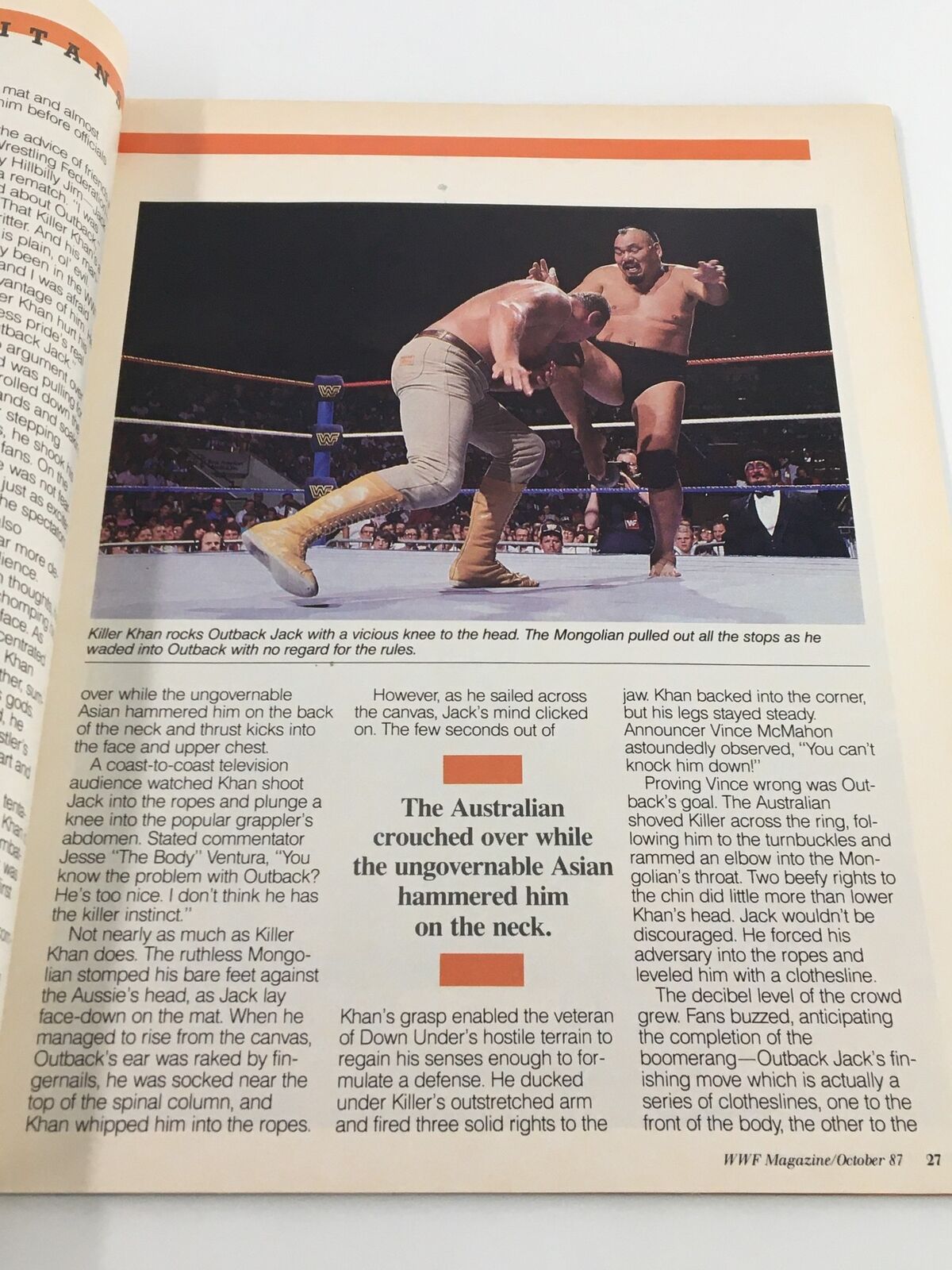 Action scene from VTG WWF Magazine October 1987 featuring Killer Khan attacking Outback Jack in a wrestling match, highlighting the excitement of professional wrestling.