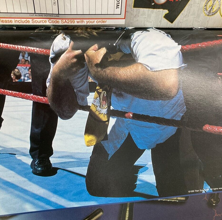 Another inside page of WWF World Wrestling Federation Magazine March 1999 featuring a dramatic wrestling moment with characters in an intense scenario.