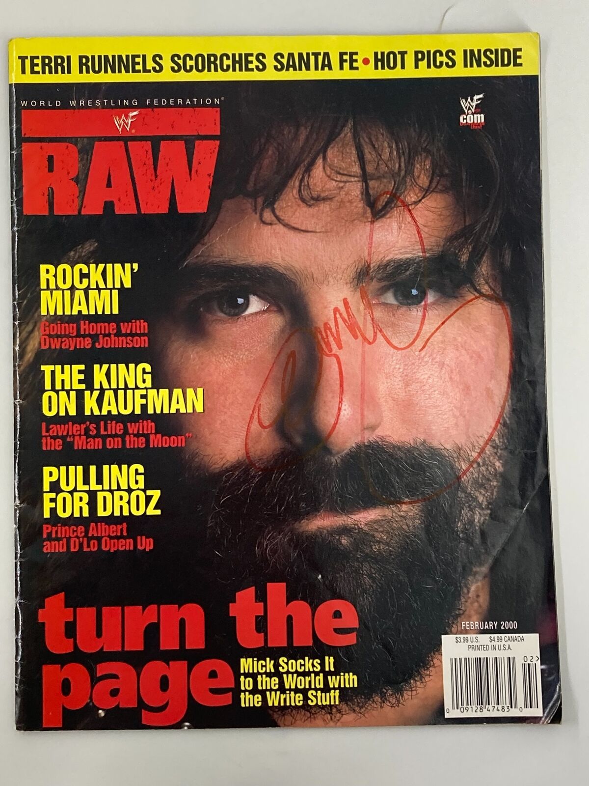 WWF Raw Magazine February 2000 featuring Mick Foley, signed and autographed, showcases iconic wrestling imagery on the cover.