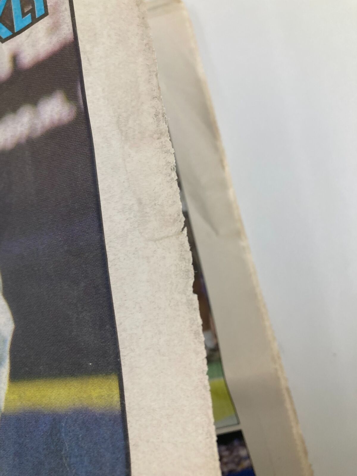 Side view of the Dallas Cowboys Weekly Newspaper September 6 1997 Vol 23 #13, capturing the worn edge and folds indicative of its vintage quality.