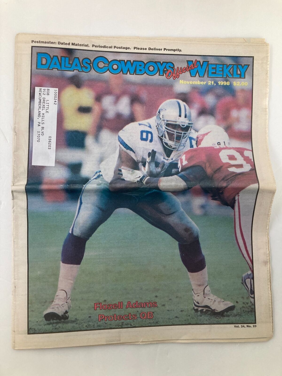 Cover of Dallas Cowboys Weekly newspaper, November 21, 1998, featuring Flozell Adams in action on the field.