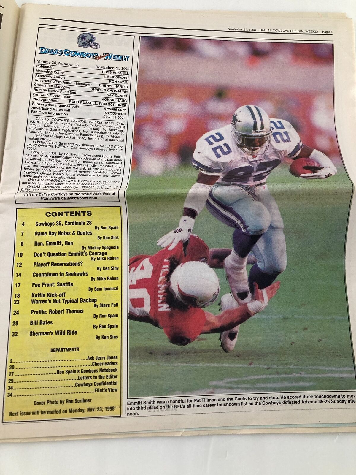 Inside page of Dallas Cowboys Weekly showing player 22, Emmitt Smith, evading a tackle during a game, with listings of contents.