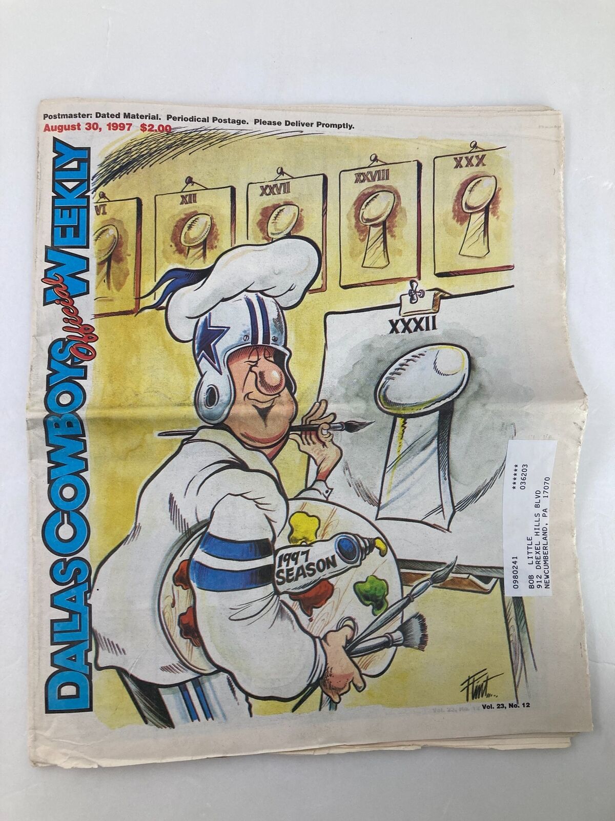 Cover of the Dallas Cowboys Weekly Newspaper August 30 1997 Vol 23 #12 featuring a cartoon chef character, symbolizing the football season with various trophies and logos in the background.