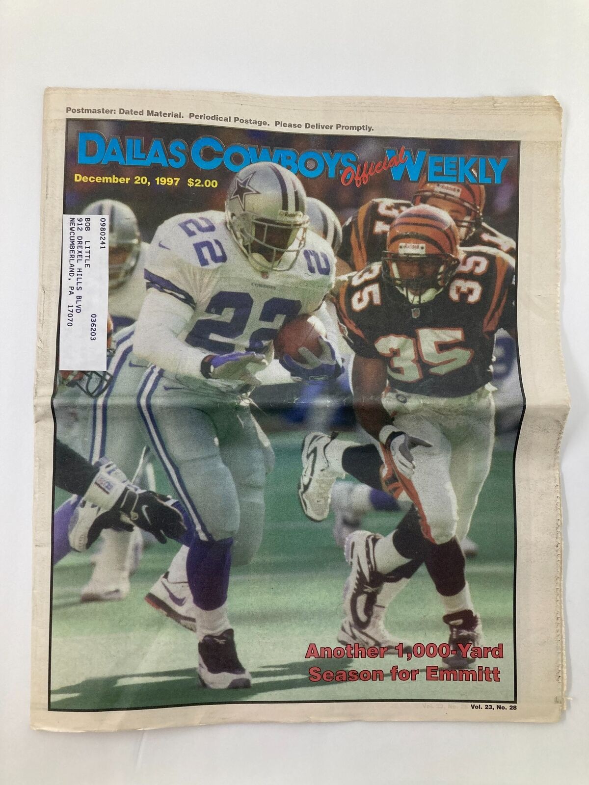 Dallas Cowboys Weekly Newspaper December 20 1997 Vol 23 #28 featuring Emmitt Smith on the cover, showcasing him in action against a defender.