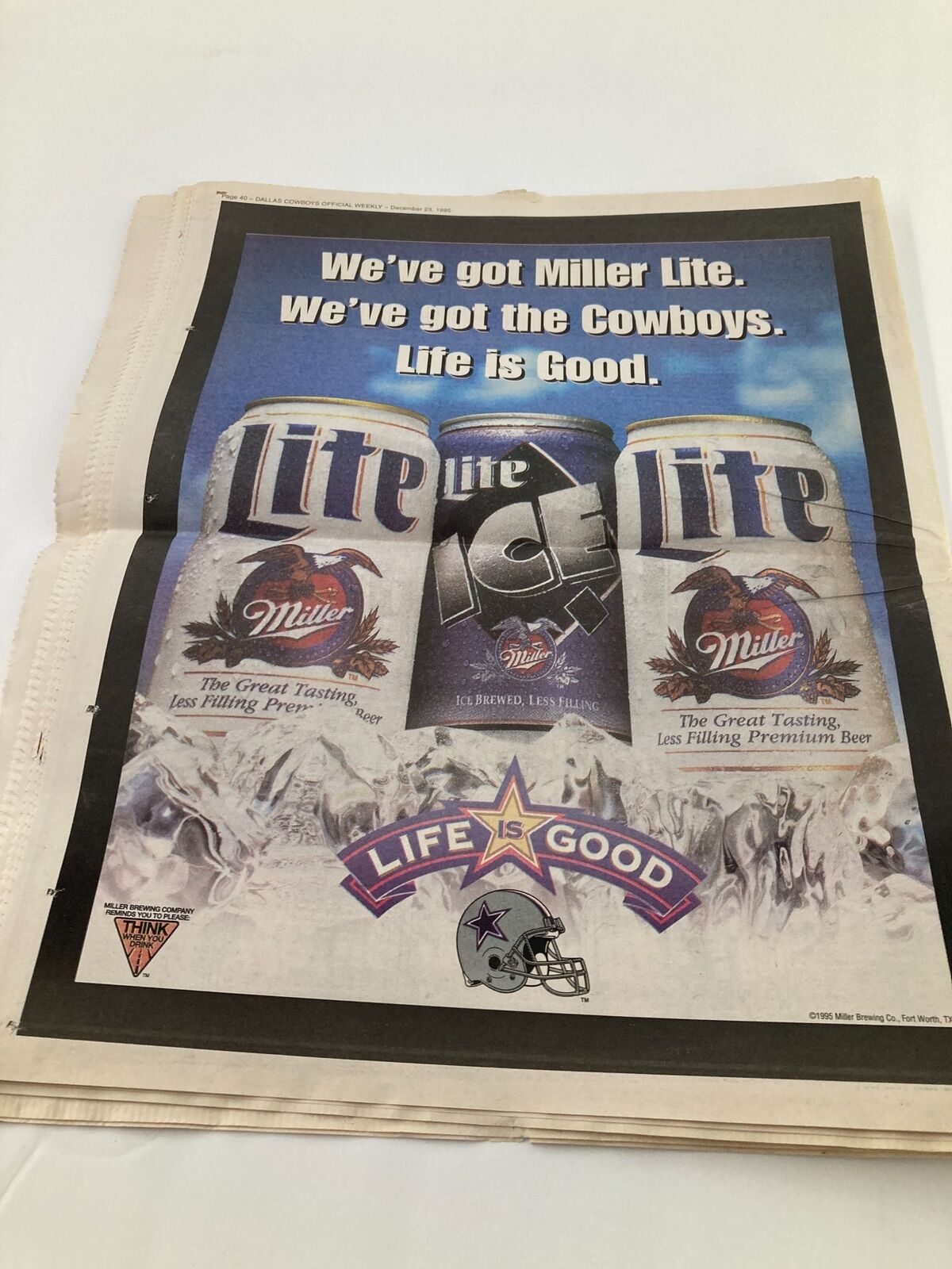 Dallas Cowboys Weekly Newspaper December 23 1995 Vol 21 #28 featuring an advertisement for Miller Lite beer with the slogan 'Life is Good' and a graphic illustration of the product.