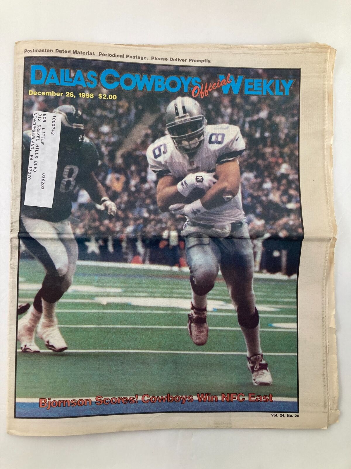 Cover of Dallas Cowboys Weekly Newspaper dated December 26, 1998, featuring Eric Bjornson celebrating a touchdown and a label on the front.