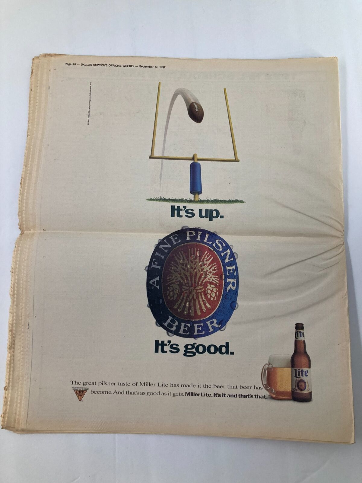 Dallas Cowboys Weekly Newspaper September 12 1992 advertisement for Miller Lite beer showcasing its slogan 'It's up. It's good.' along with an image of a beer bottle and a football goal post.
