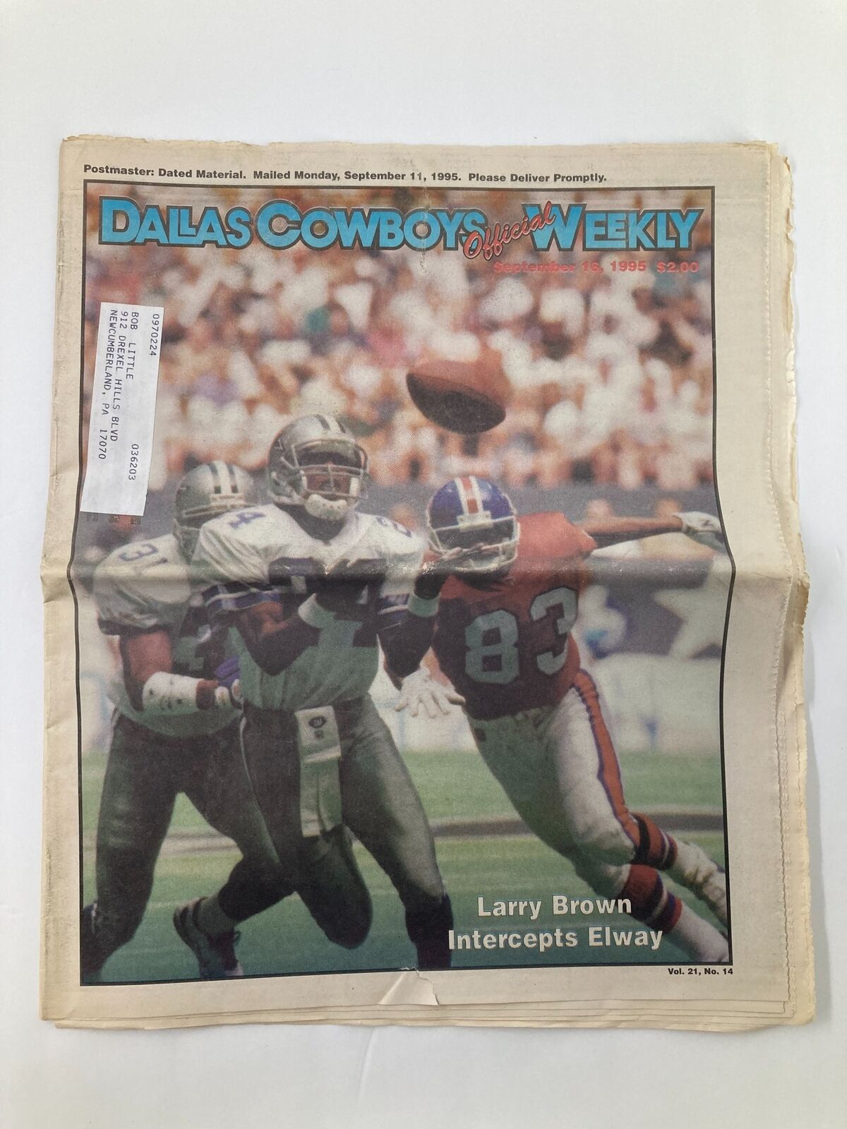 Cover of the Dallas Cowboys Weekly Newspaper dated September 16, 1995, showcasing Larry Brown's interception of Elway. The newspaper has minor wear and is presented in a folded format.