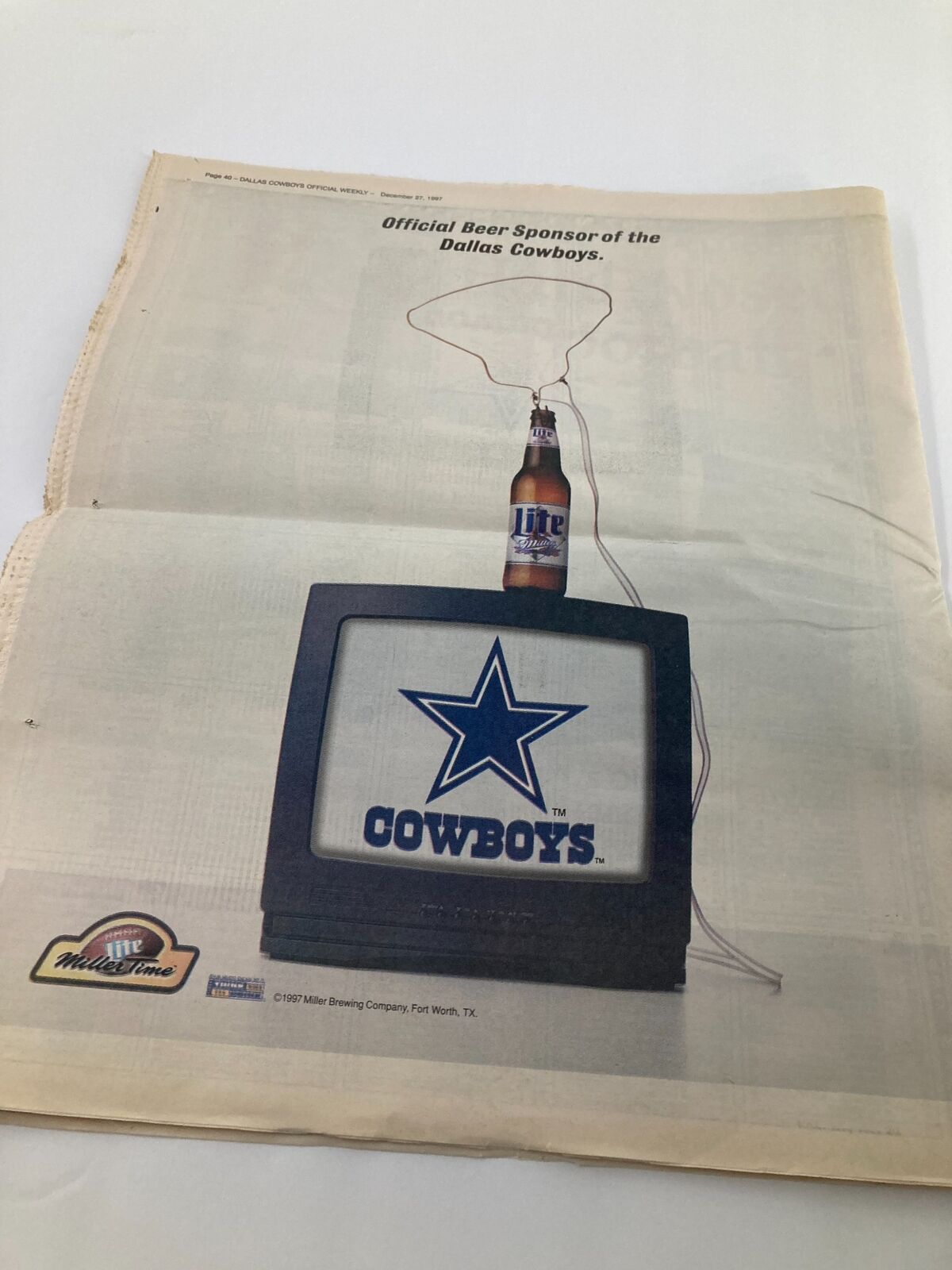 Dallas Cowboys Weekly Newspaper December 27 1997 Vol 23 #29 Anthony Miller - Advertisement showcasing official beer sponsor Miller Brewing Company alongside Dallas Cowboys branding.