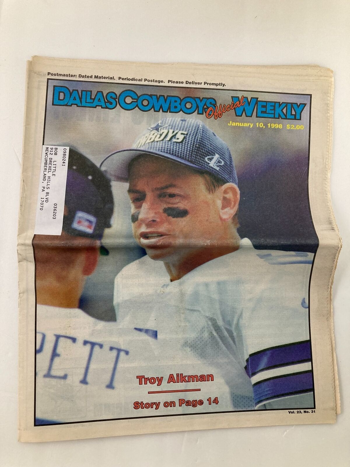 Dallas Cowboys Weekly Newspaper January 10 1998 Vol 23 #31 featuring Troy Aikman on the cover, showcasing a photograph of Aikman during a game.