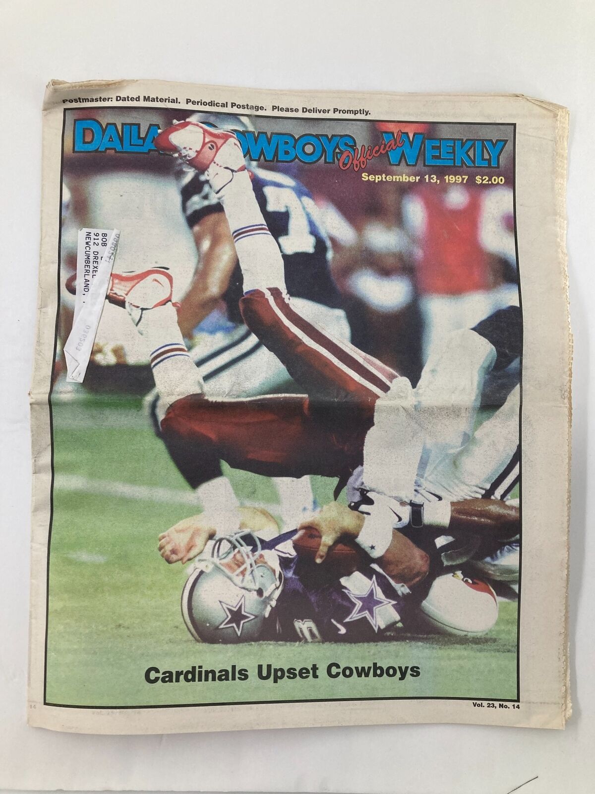 Cover of the Dallas Cowboys Weekly Newspaper from September 13, 1997, featuring a headline about the game where Cardinals upset Cowboys, Volume 23, #14, with an image of players in action.