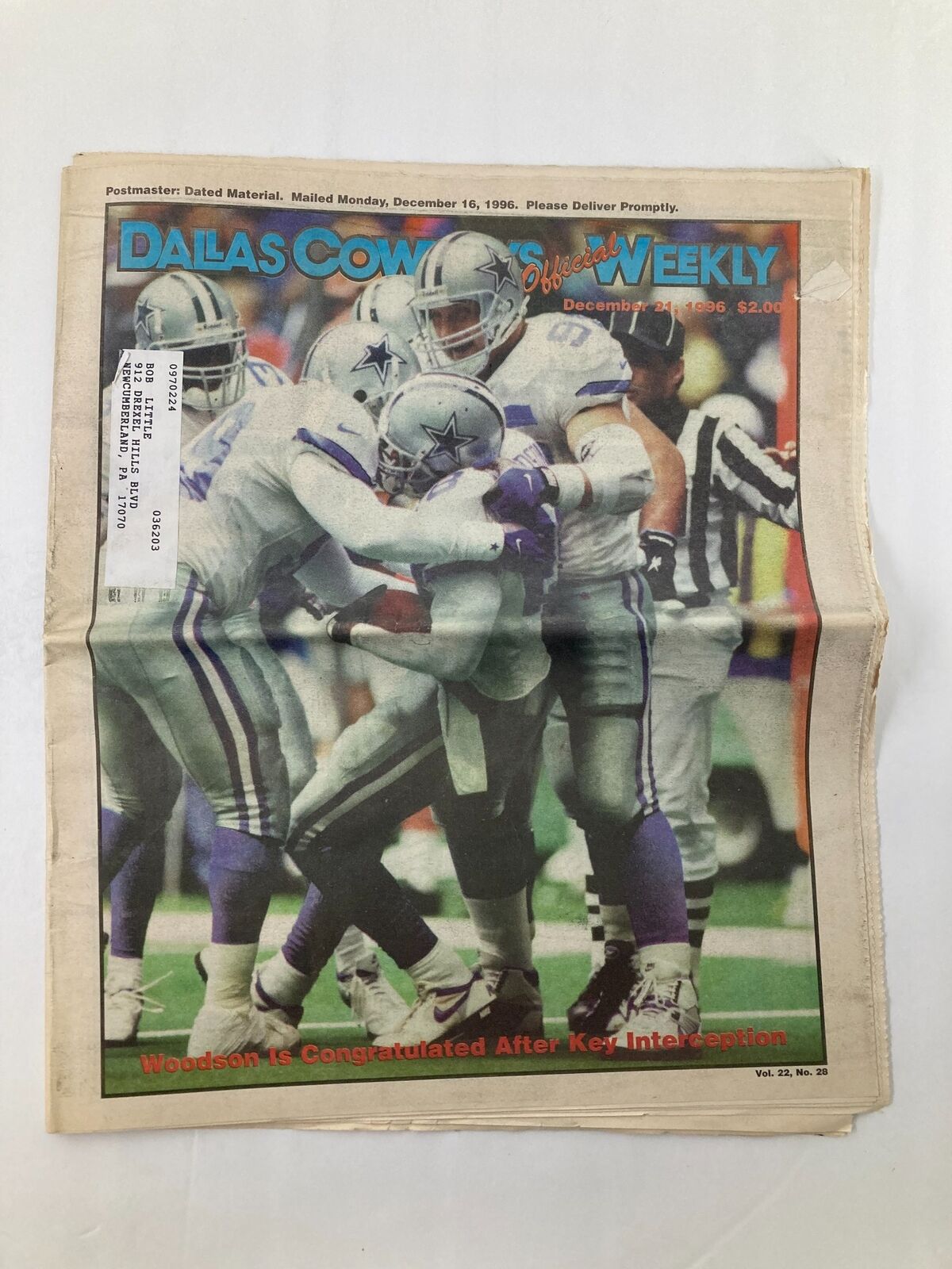 Dallas Cowboys Weekly Newspaper December 21 1996 Vol 22 #28 featuring Darren Woodson celebrating after a key interception, showcasing vibrant photography and details of the game.