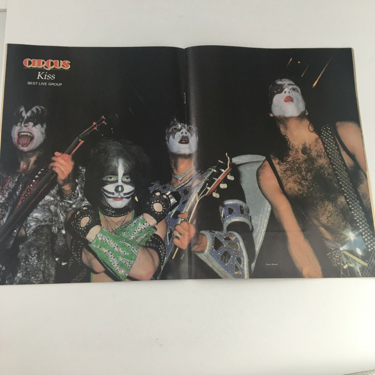Inside spread of Circus Magazine with a feature on the rock band Kiss, showcasing their performance and iconic style, emphasizing their status as the Best Live Group.