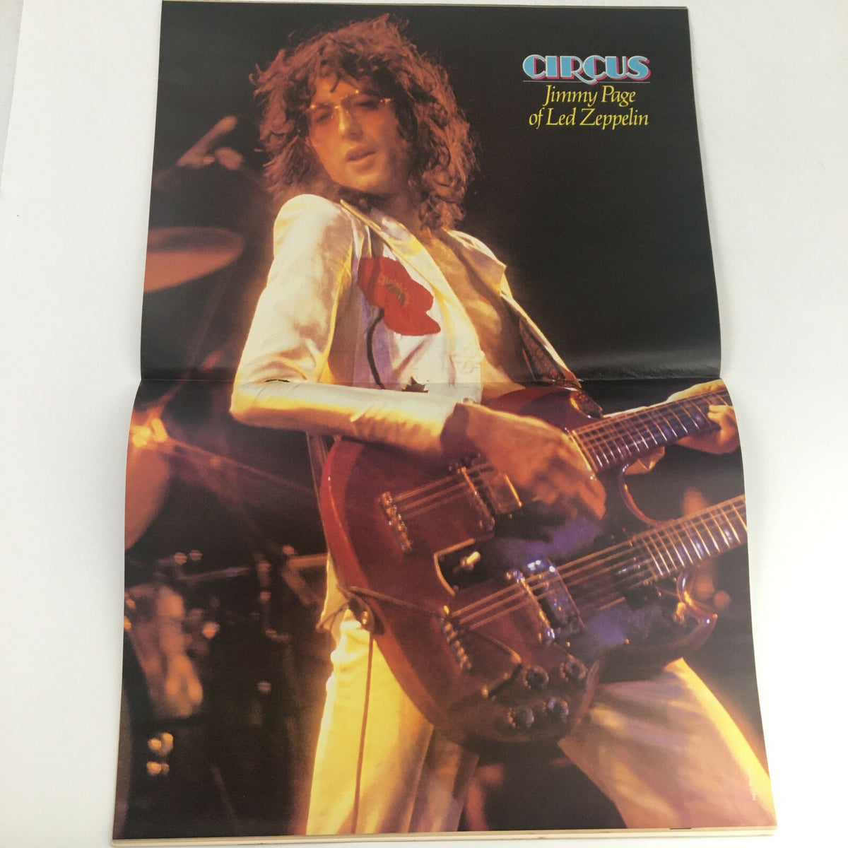 Poster of Jimmy Page of Led Zeppelin from Circus Magazine June 23 1977, showcasing the guitarist during a performance.