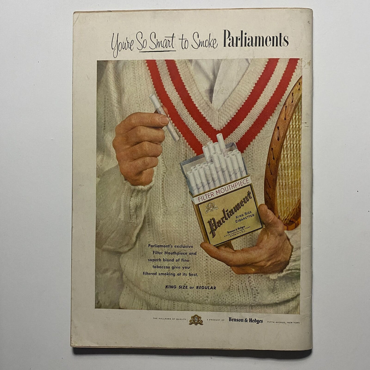Cigarette advertisement for Parliaments featuring a man holding a pack and discussing its unique filter. From Sports Illustrated Magazine August 16 1954 First Edition Premier Issue.