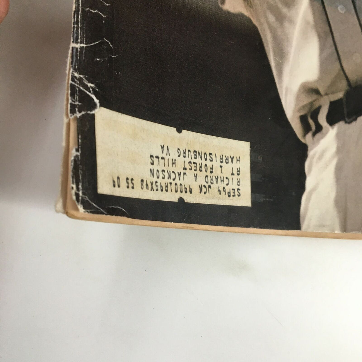 Detail of the back cover of a vintage Sports Illustrated magazine from May 11, 1984, showing a label and worn edges, emphasizing its history and collectible status featuring Al Kaline.