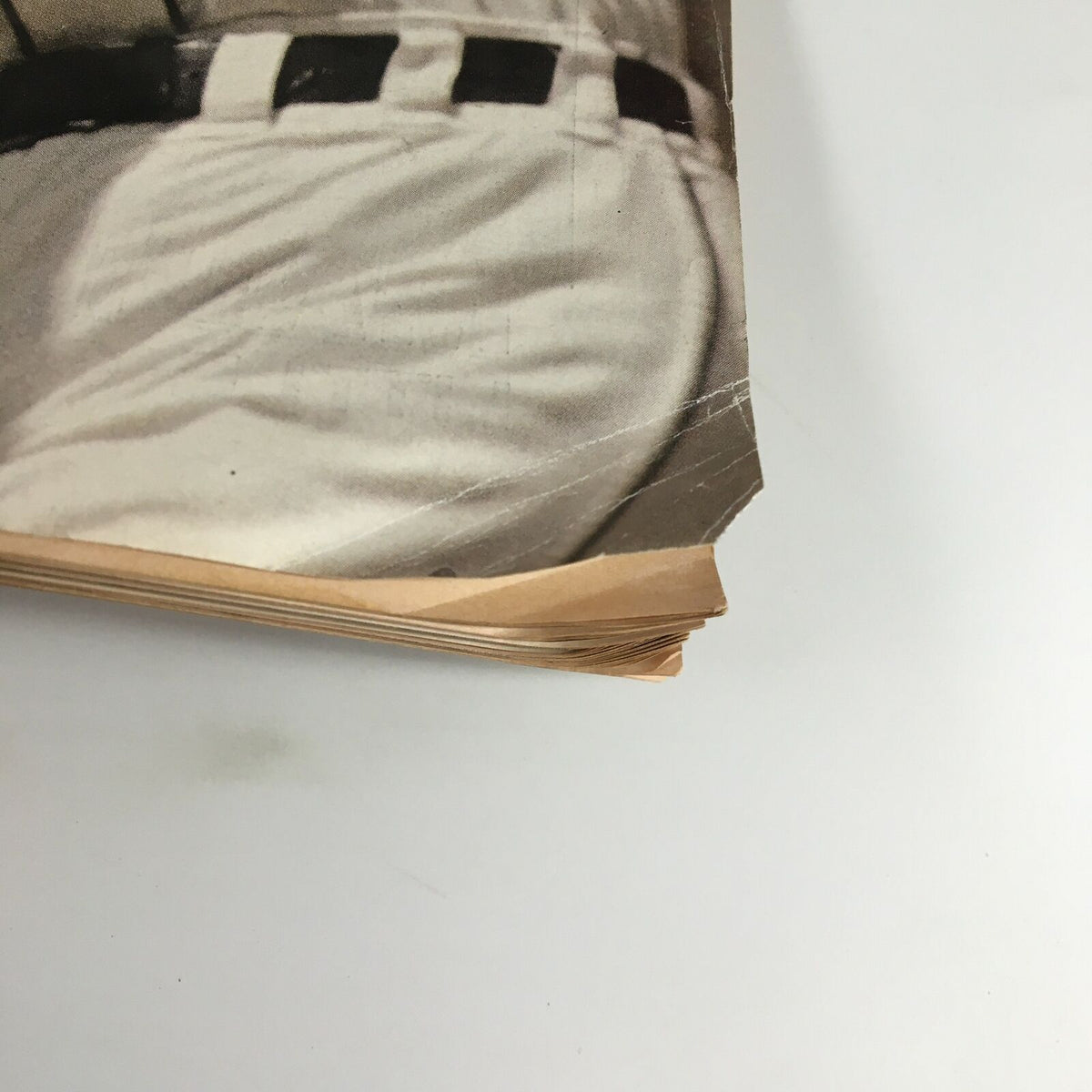 Close-up of the spine and pages of a vintage Sports Illustrated magazine from May 11, 1984, highlighting the wear, frayed edges, and distinctive style of the publication focused on Al Kaline.