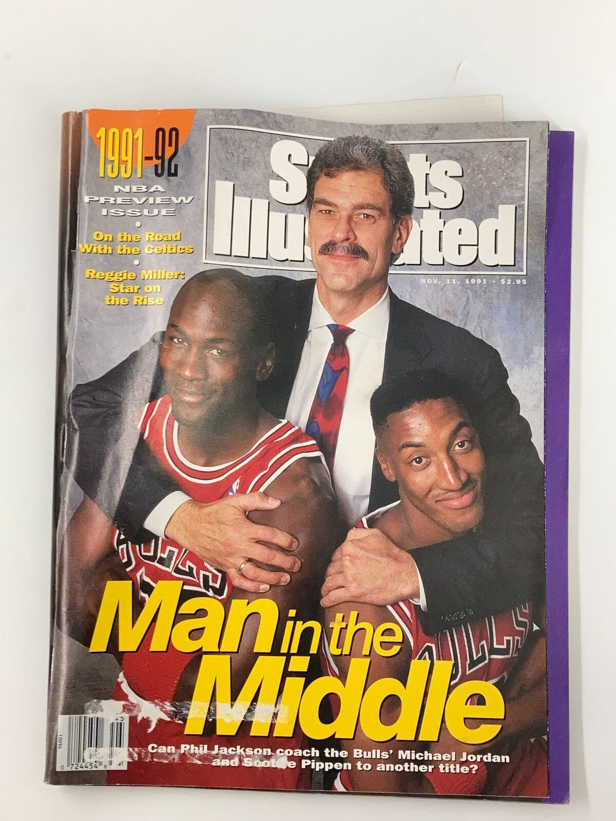 Sports Illustrated Magazine from November 11, 1991, featuring Michael Jordan, Scottie Pippen, and Phil Jackson on the cover, titled 'Man in the Middle'.