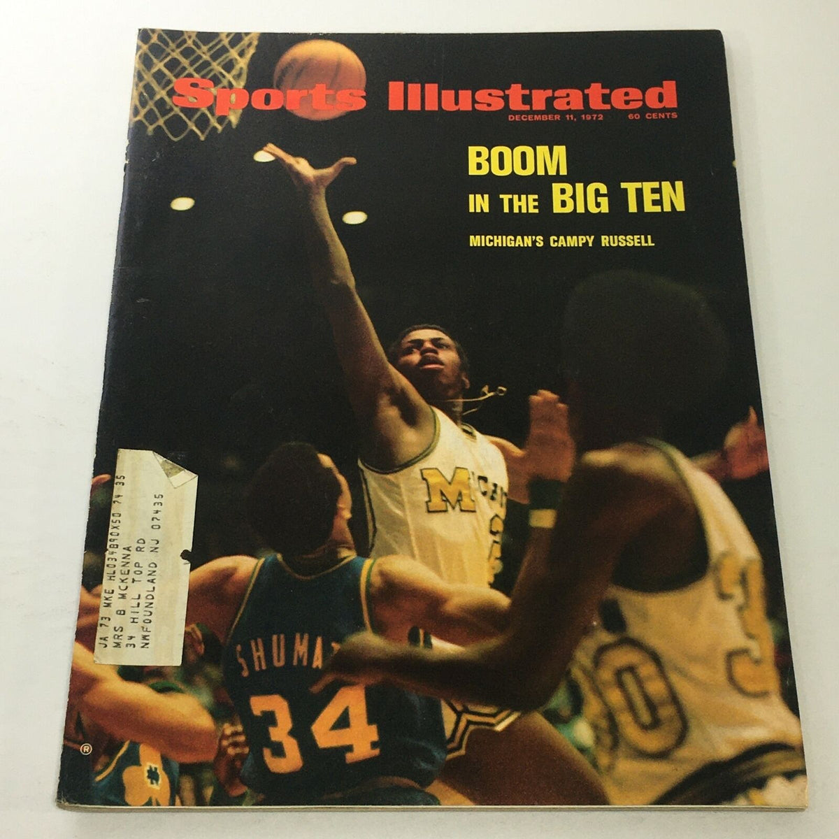 Sports Illustrated cover from December 11, 1972 featuring Michigan's Campy Russell in action, showcasing a basketball game moment.