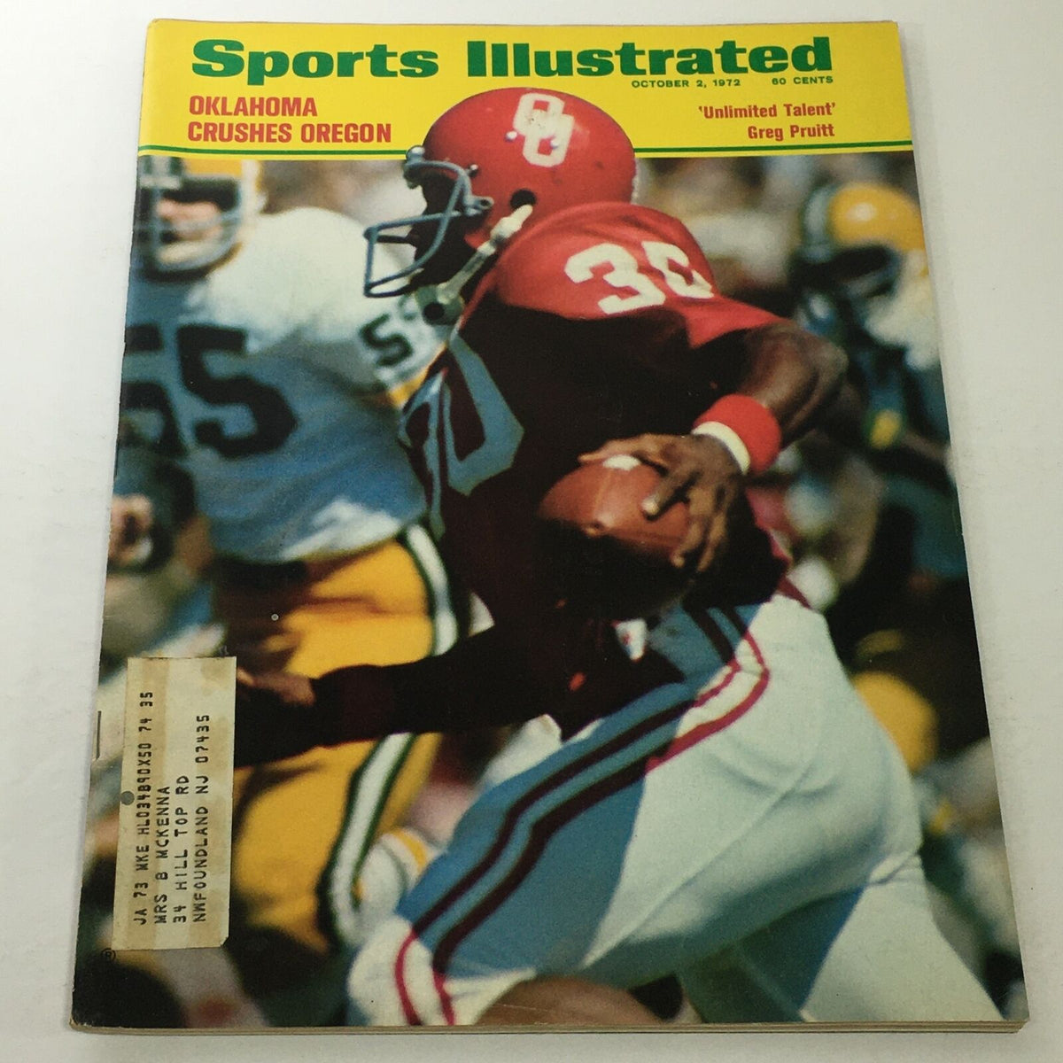 Sports Illustrated cover from October 2, 1972, featuring Greg Pruitt, showcasing his talent as an Oklahoma football player. The image captures Pruitt running on the field with defenders in the background.