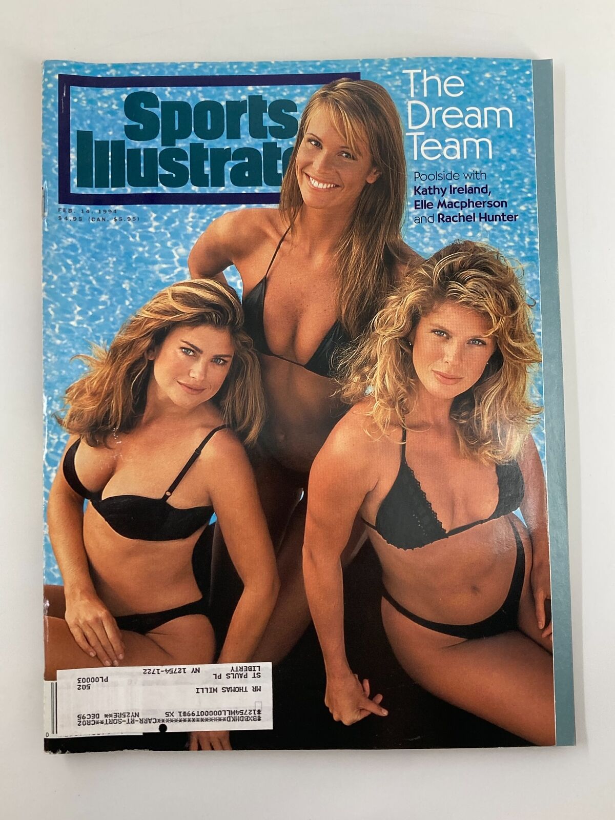 Sports Illustrated Magazine cover from February 14, 1994 featuring models Kathy Ireland, Elle Macpherson, and Rachel Hunter, posing poolside in black swimwear, representing the iconic 'Dream Team' theme in sports fashion.