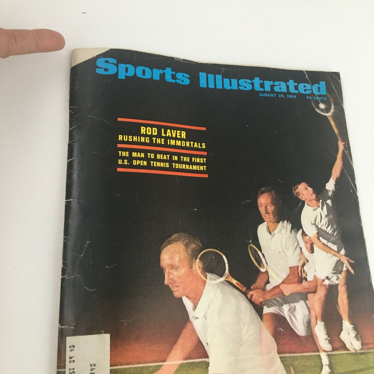 Close-up view of the Sports Illustrated Magazine cover from August 26 1968, highlighting Rod Laver and the tagline 'The Man to Beat in the First U.S. Open Tennis Tournament'.