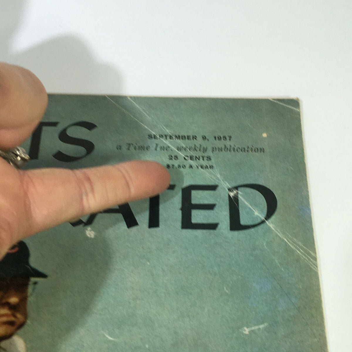Close-up of the cover details of the Vintage Sports Illustrated Magazine from September 9, 1957. The publication date and pricing are highlighted, showcasing its retro appeal and status as a collectible item.