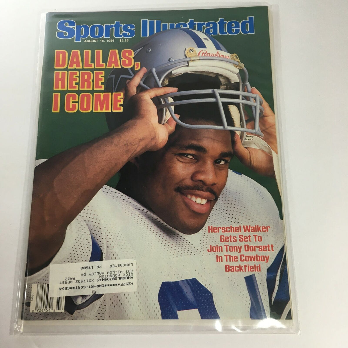 Sports Illustrated magazine cover featuring Herschel Walker, titled 'Dallas, Here I Come,' from August 18, 1986, showing Walker in a football helmet and uniform, ready for action.