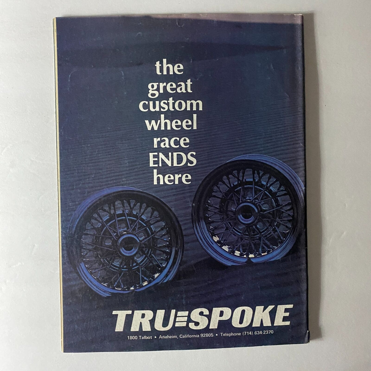 Cover of Truckin' Magazine March 1976 featuring the tagline 'the great custom wheel race ENDS here' with an image of custom wheels, showcasing vintage automotive culture.