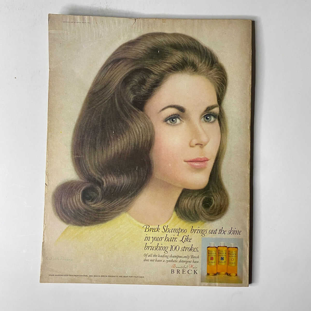 Back cover of Vogue Magazine August 15, 1967 featuring an advertisement for Breck Shampoo, promoting hair care and beauty.
