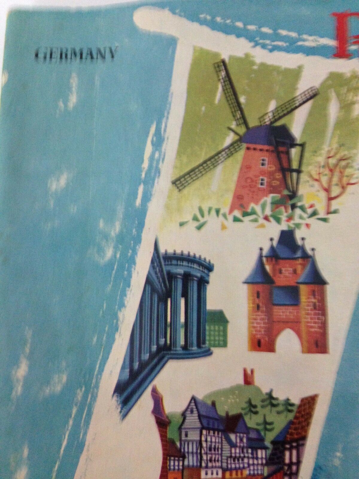 Close-up of the cover of Vintage 1950s GUIDE BOOKLET Rhineland Germany, highlighting windmill illustration and architectural features.
