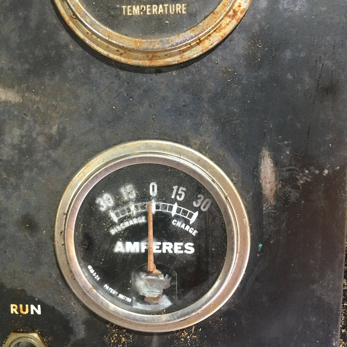 Temperature Water, Oil, Amps, Meter, Gauge Triple Auto Panel showing an ammeter gauge indicating current flow and temperature settings.