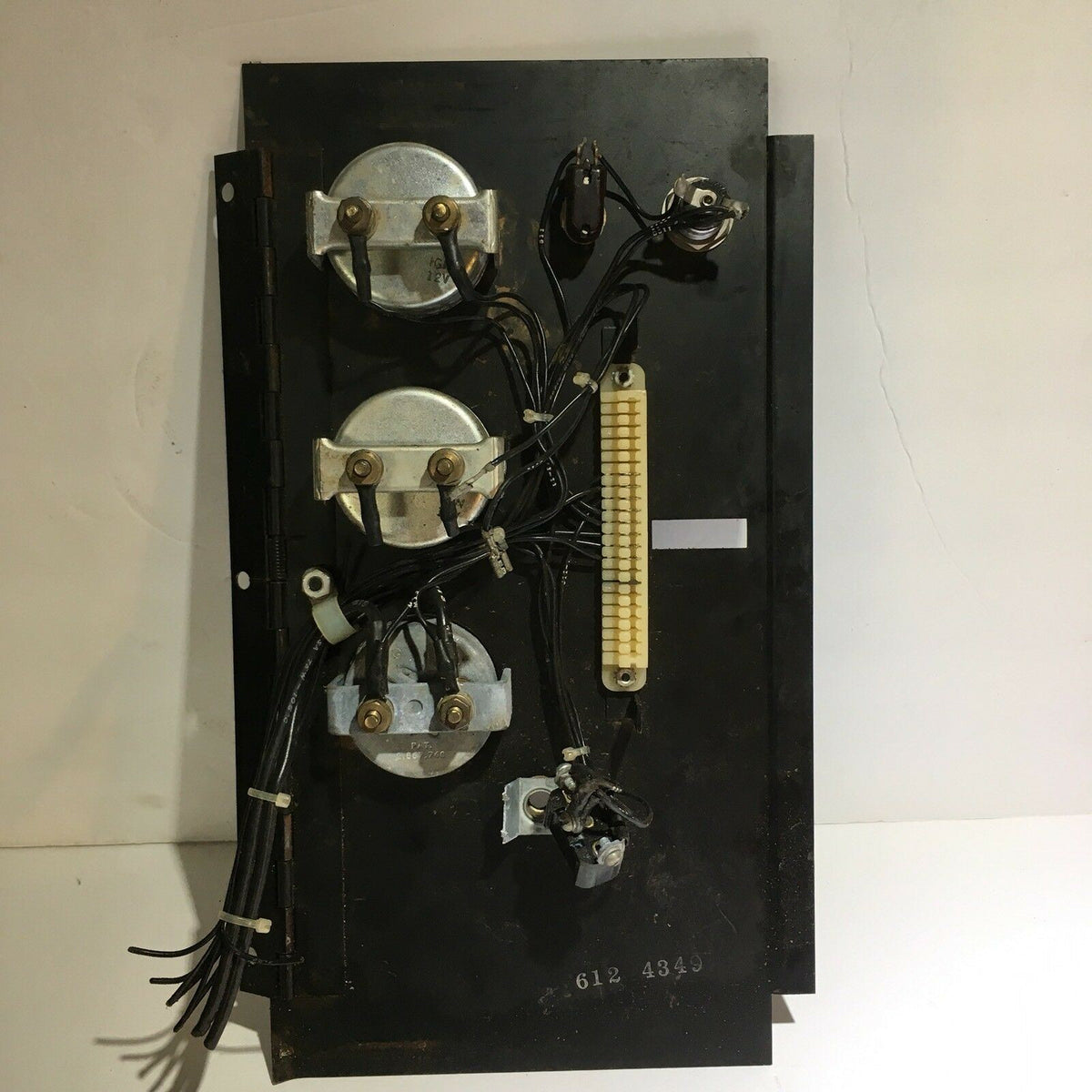 Temperature Water, Oil, Amps, Meter, Gauge Triple Auto Panel equipped with multiple electrical components and wiring, showcasing the panel's operational layout.