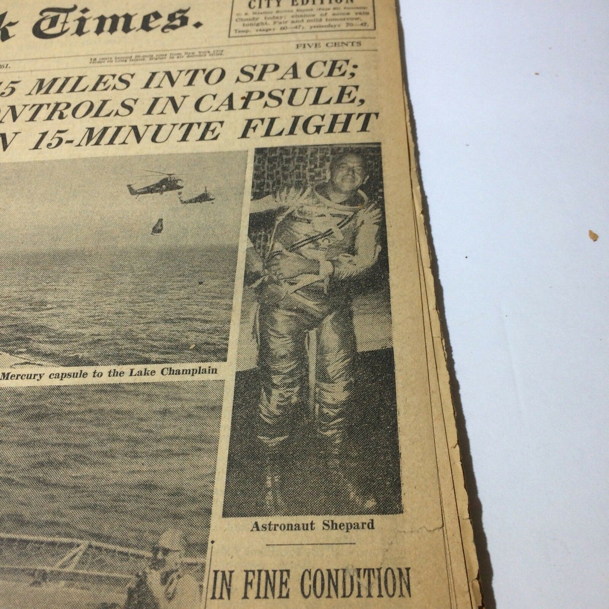 Detailed view of the May 6, 1961 New York Times newspaper featuring an image of astronaut Shepard and the headline on the US space flight initiative.