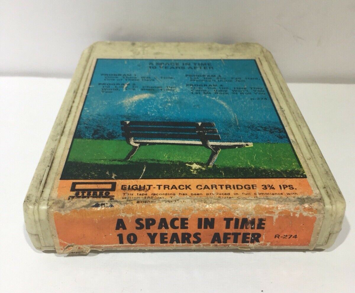 Side view of the rare 'A Space In Time' 8 Track Tape by Ten Years After displaying wear and age, highlighting its collectible nature for vintage music enthusiasts.