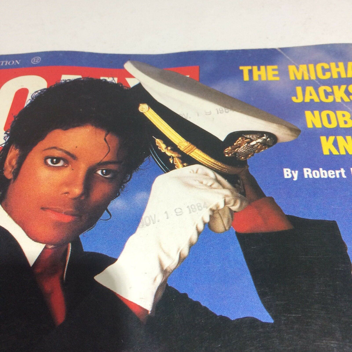 Close-up view of the cover of December 1984 Ebony Magazine with the title 'The Michael Jackson Nobody Knows', highlighting Michael Jackson's expression and fashion on the iconic front page.