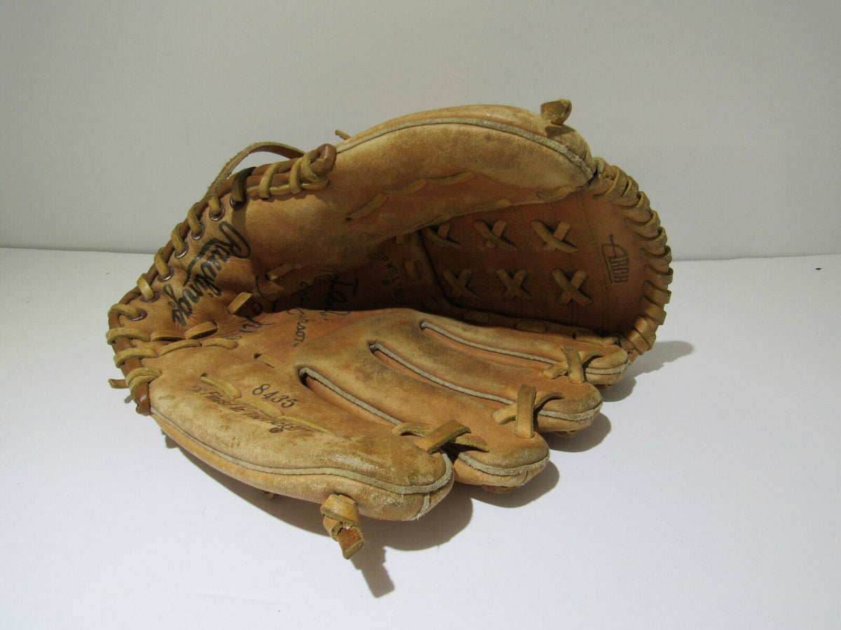 Vintage Rawlings Reggie Jackson Baseball Glove 8435 Ball Mitt displayed from the back angle, highlighting the stitching and vintage condition.