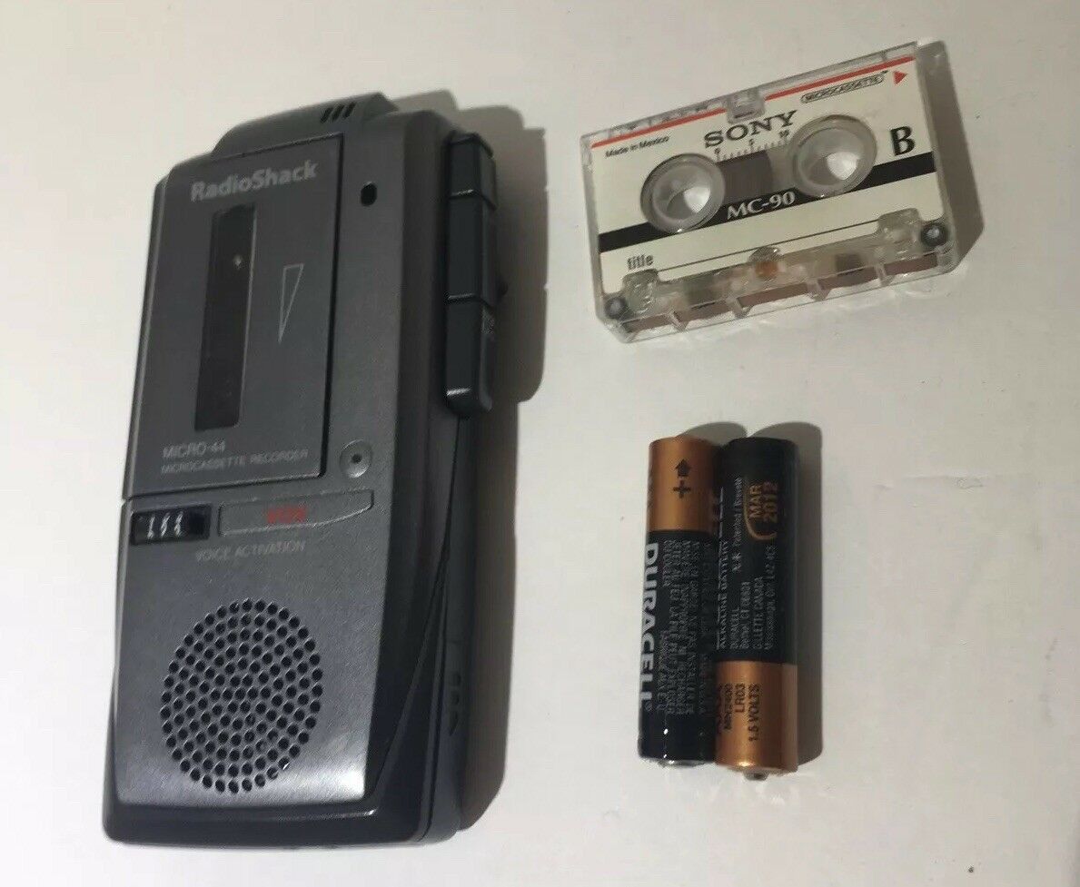 Vintage Radio Shack Micro-44 Micro Cassette Recorder with included cassette and batteries, showcasing nostalgic audio recording technology.