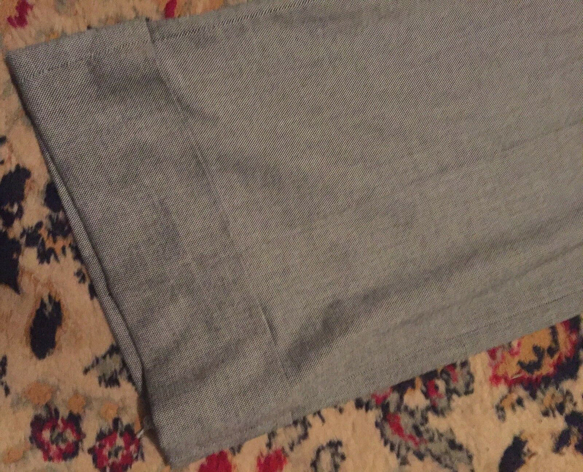 Close-up image of the wide cuff hem of Ann Taylor Loft Women's Dress Pants, demonstrating the fine fabric and timeless design.