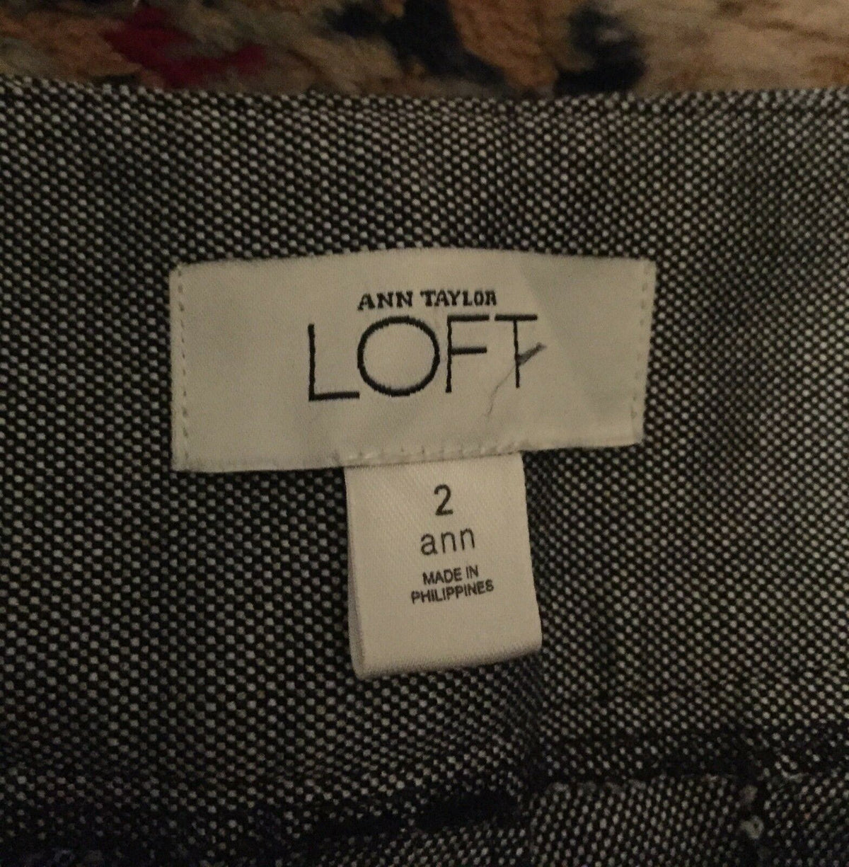 Label of Ann Taylor Loft dress pants size 2, showcasing fine white and black design, part of women's wide cuff leg pants collection.