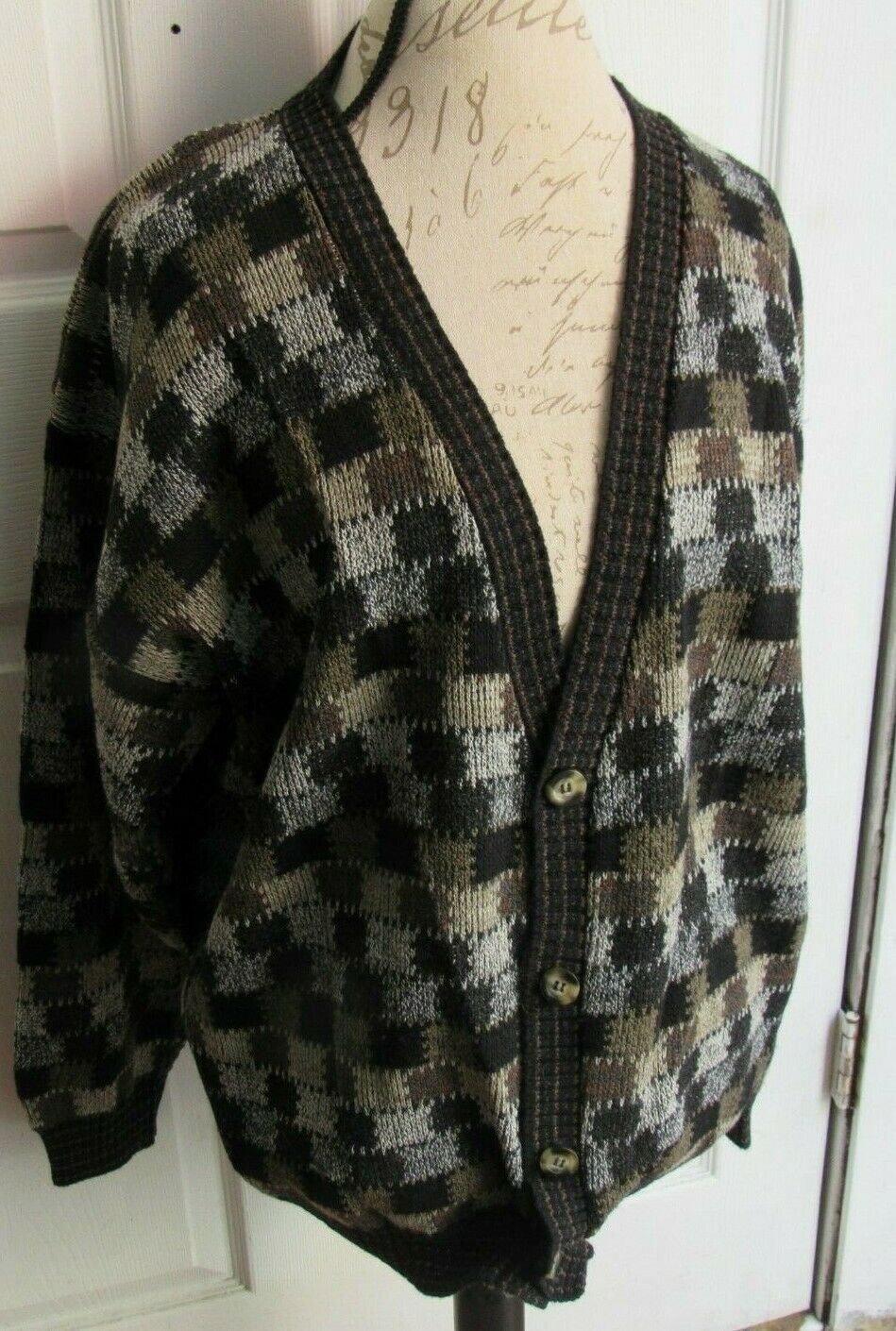 Side view of the Vintage 1990s Protege Collection Cardigan Sweater in Checks Plaid design, size Large, featuring a cozy knit structure with black and brown color scheme, presented on a mannequin.