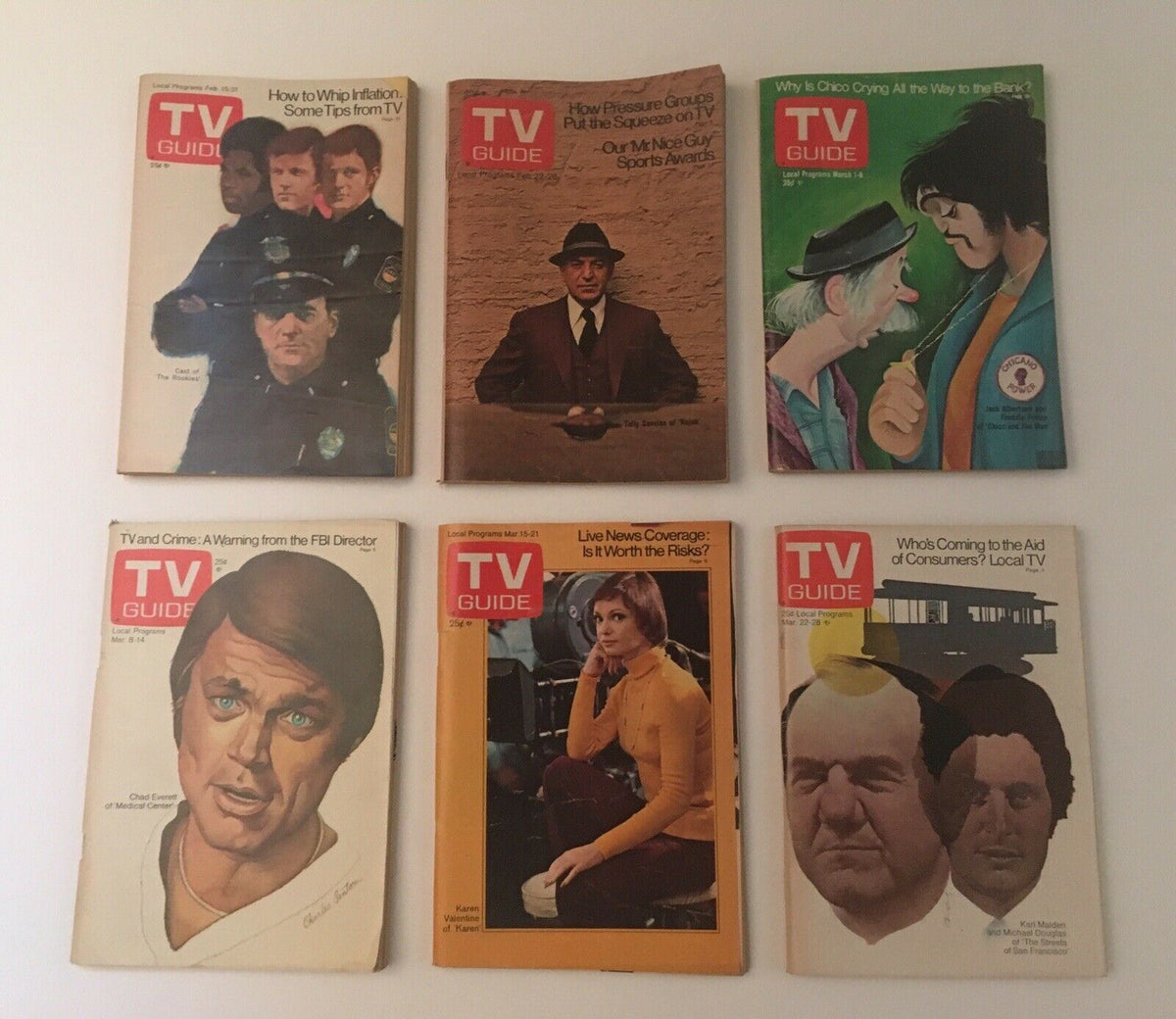 Complete Year of TV Guide Magazines 1975: A collection of classic TV Guide covers highlighting significant cultural moments and television programs from 1975, perfect for collectors.
