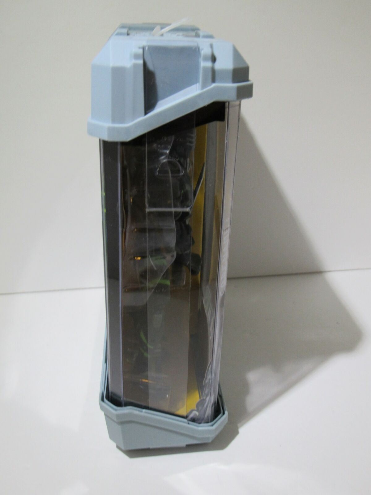 Side view of G.I. Joe Sigma 6 Snake Eyes Ninja Armor 8 Inch action figure packaging, highlighting the unique design and storage features.