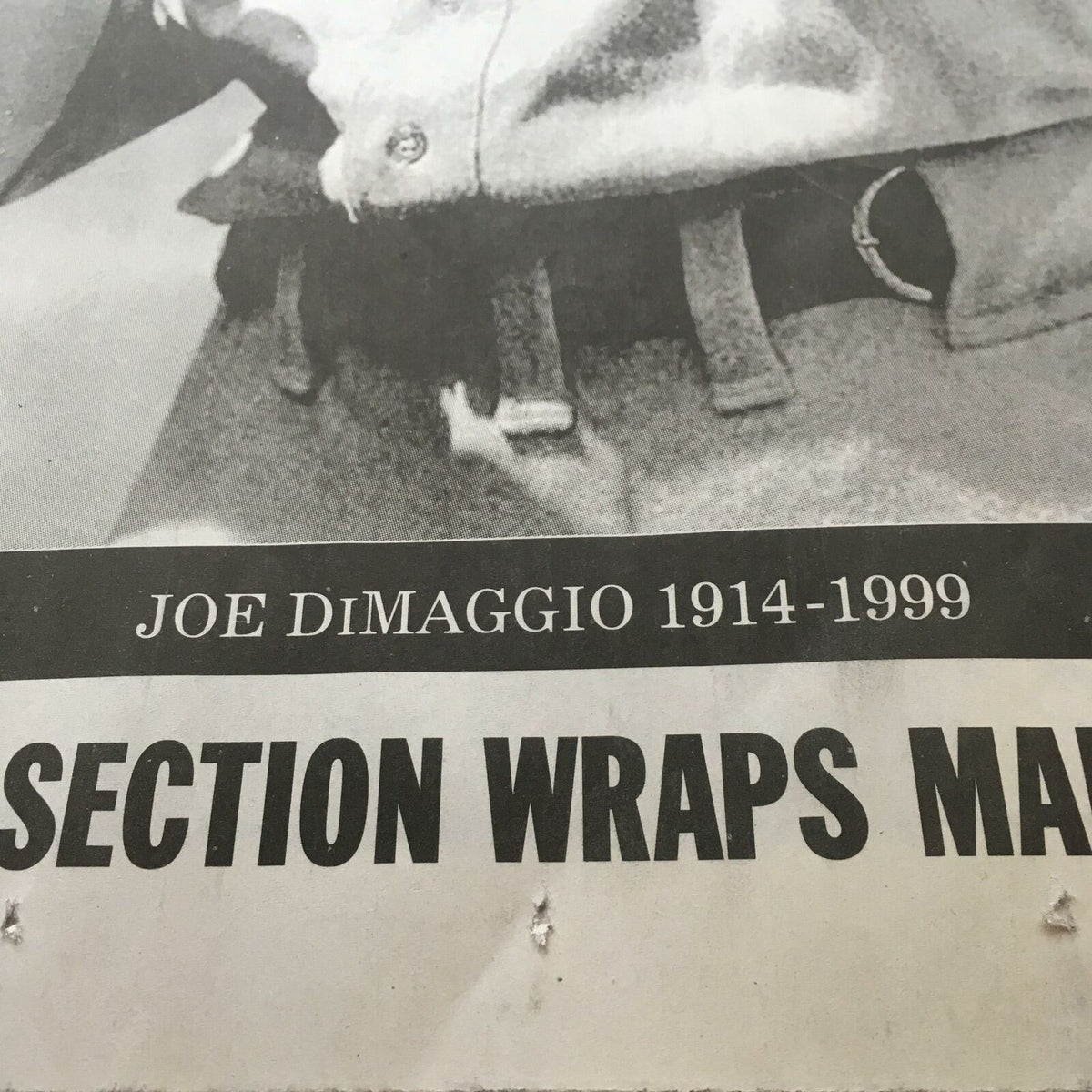 Section of the NY Daily News newspaper highlighting 'JOE DIMAGGIO 1914-1999,' commemorating the legacy of the Yankee great with the title 'Farewell Yankee Clipper Joe Dimaggio 1914-1999.'