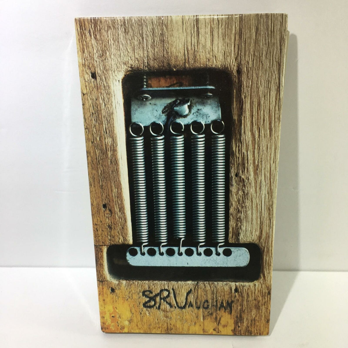 Cover of the Stevie Ray Vaughan And Double Trouble 4 Disc Box Set Audio CD featuring a vintage guitar and strings design.