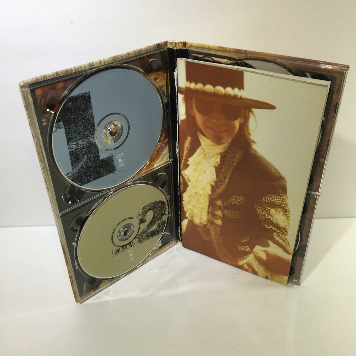 Stevie Ray Vaughan And Double Trouble 4 Disc Box Set Audio CD opened, showing discs and album cover.