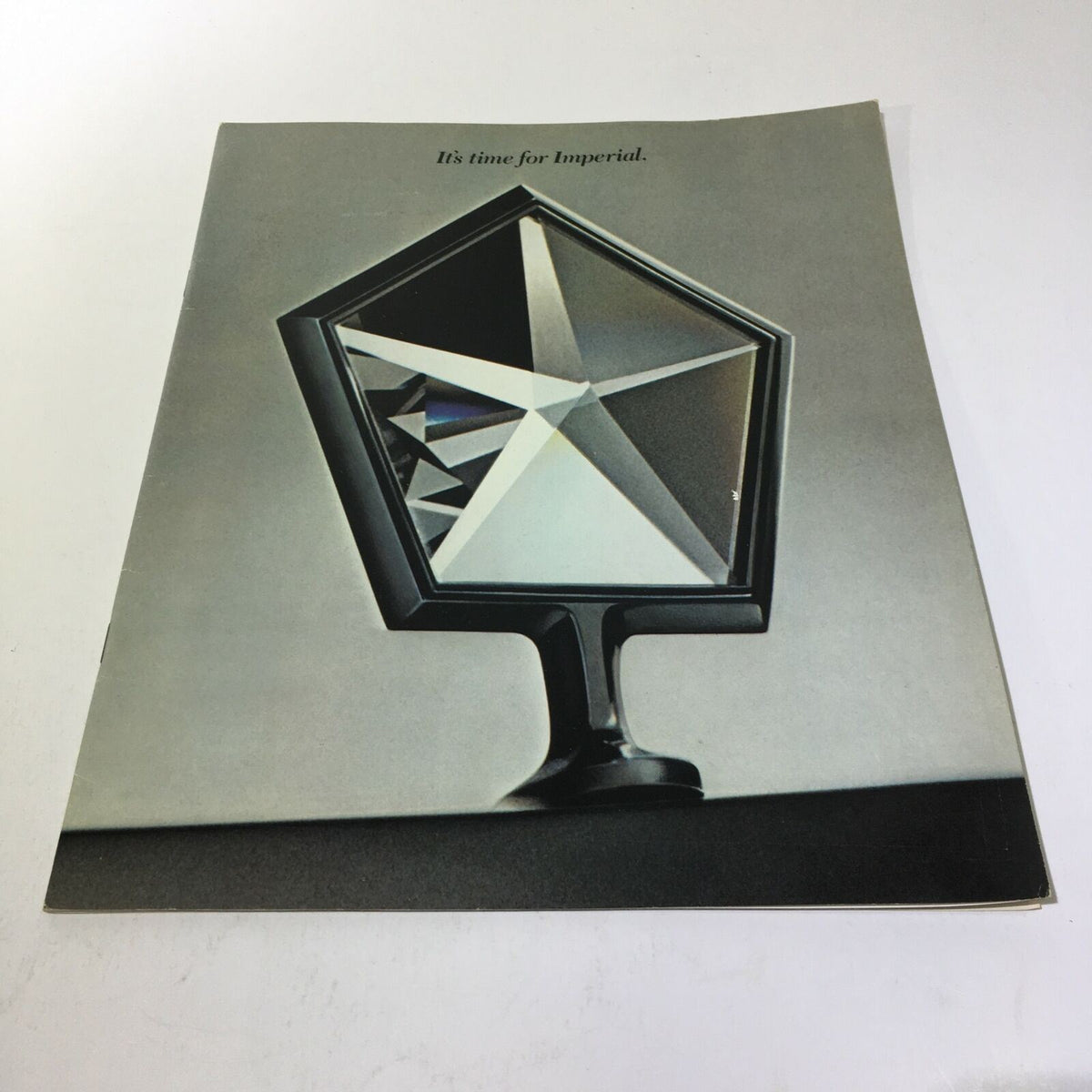 Cover of the 1981 Imperial in Sterling Silver Crystal Coat - Imperial Car Sale Brochure, featuring a distinctive crystal-like geometric shape.