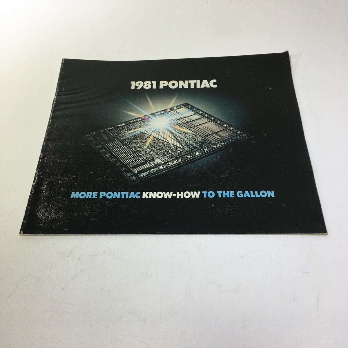 Cover of the 1981 Pontiac Sophisticated Firebird V-8 Engine 4-Speed Manual Car Sale Brochure featuring a radiant light effect.