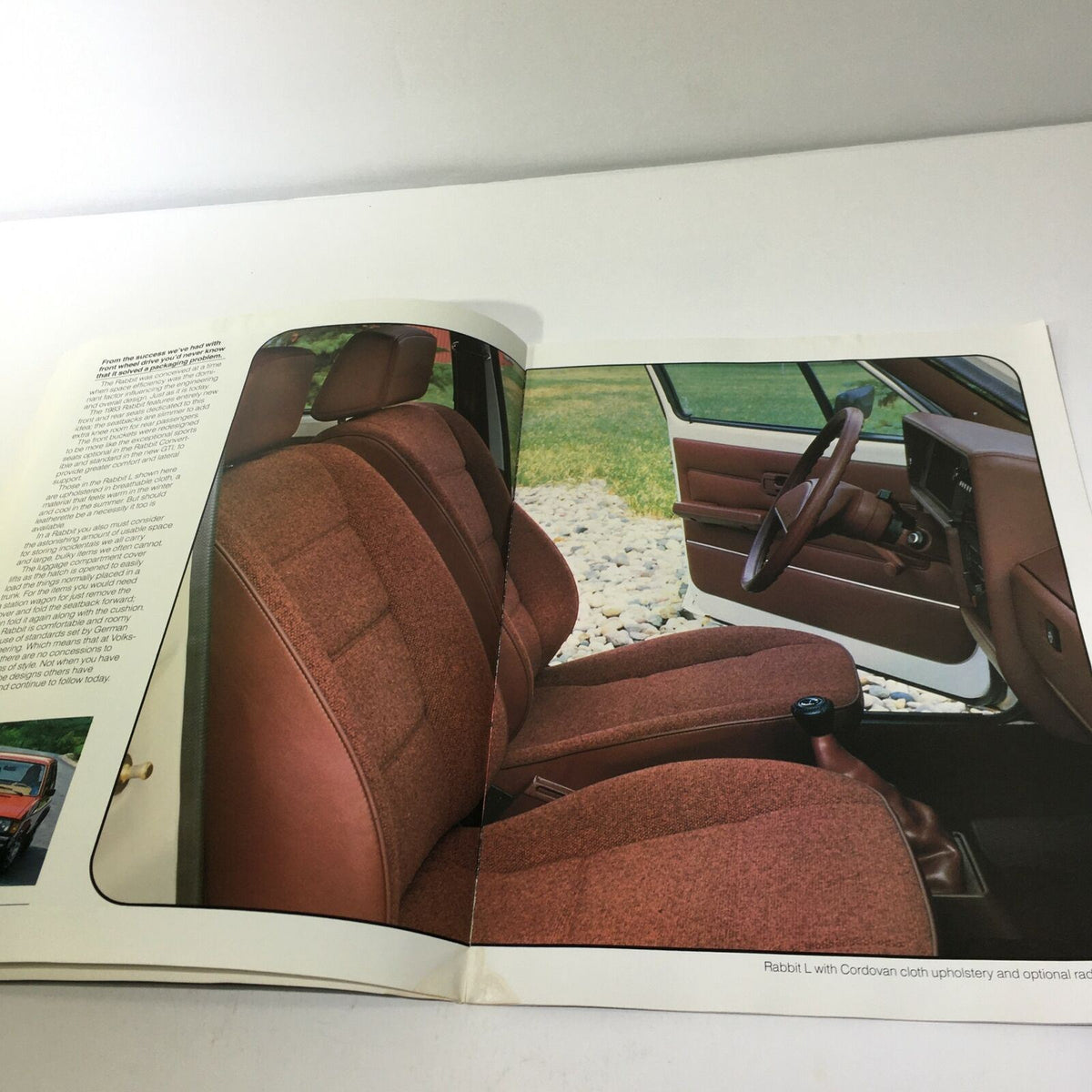 Interior view from the 1983 Volkswagen Rabbit GTI 2-Door Sedan Car Sale Brochure highlighting the Cordovan cloth upholstery of the Rabbit L.